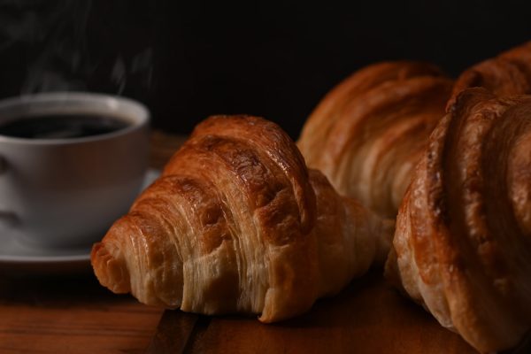 tasty-croissants-and-hot-coffee-on-wooden-wooden-board-ready-to-serve-for-breakfast-breakfast-bread-bakery-products-cafe-concept